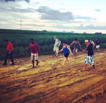 Our old faithful bus gets stuck on a mud road on way to a village. Yep...Push!! PhotoCred:Jaime Lawhorne